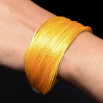 Load image into Gallery viewer, Chic silver moli bracelet with a striking yellow thread, perfect for adding a pop of color