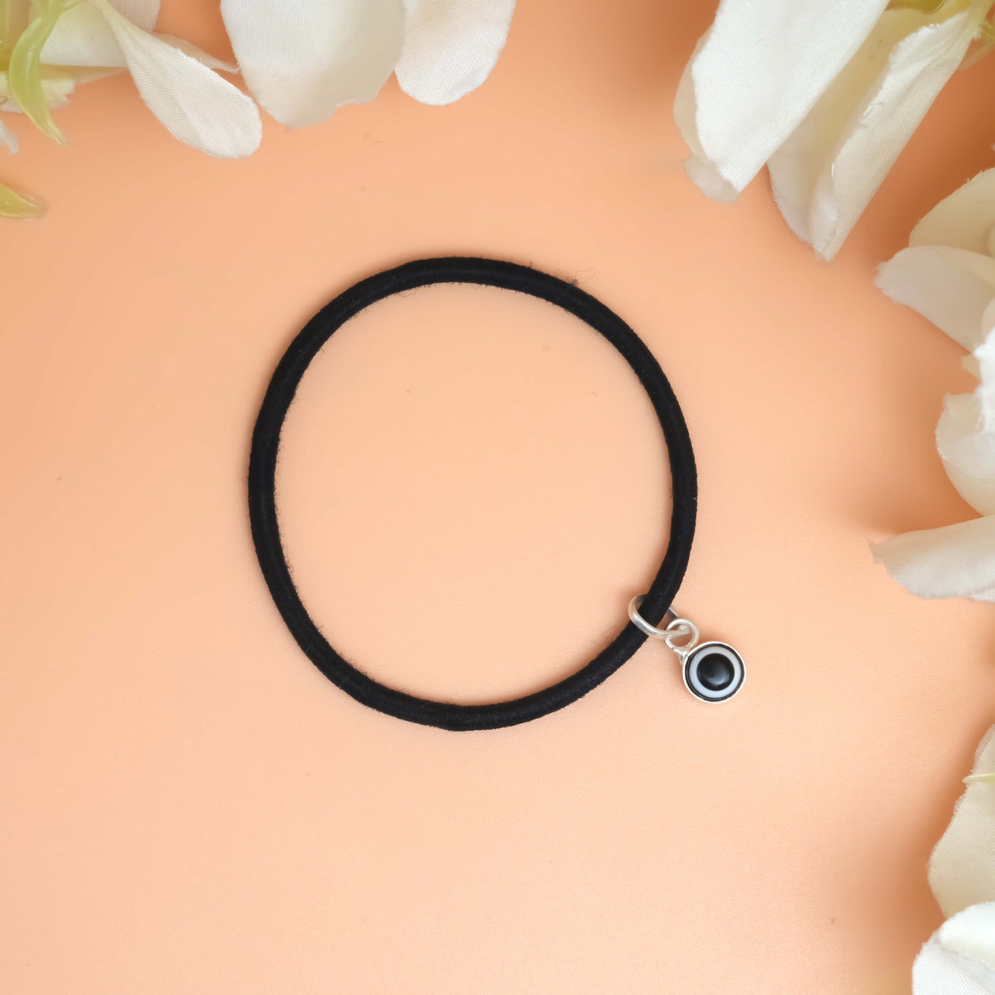 Bracelet with a bold black Evil eye charm