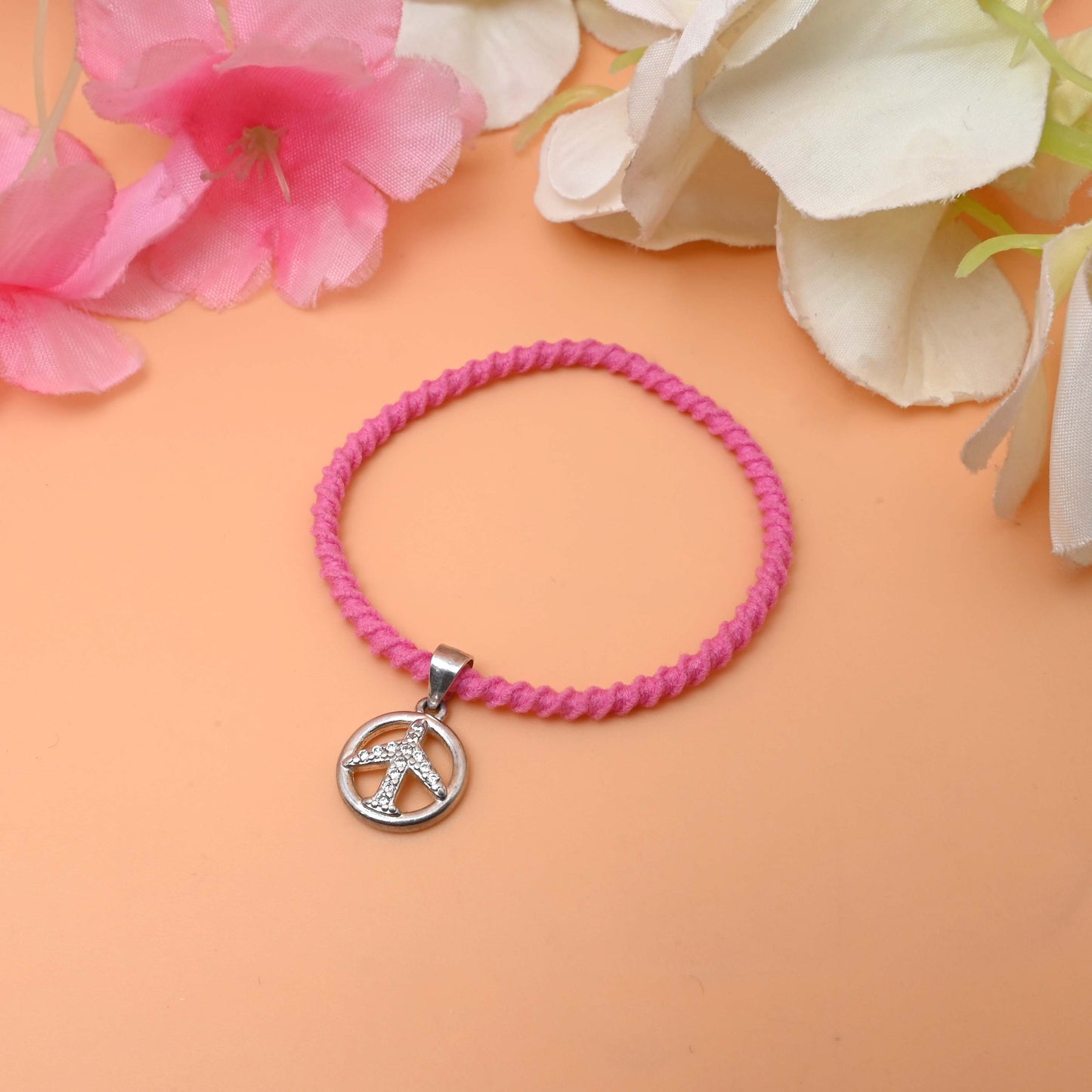A Bracelet with a peace sign charm