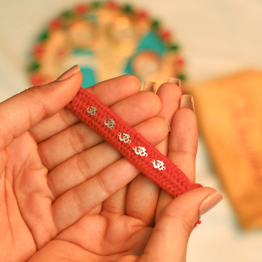 Silver Rakhi with Om Charm