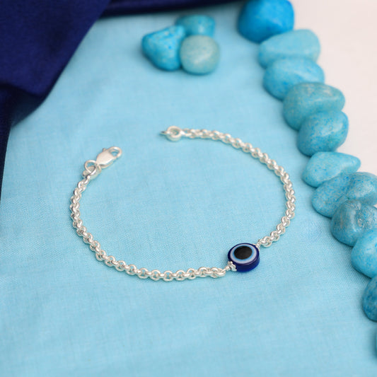 Elegant silver chain bracelet adorned with a protective evil eye