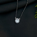 Load image into Gallery viewer, Black beads mangalsutra featuring oval-shaped stone pendant.