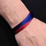 Load image into Gallery viewer, Stylish silver bracelet with a vibrant blue and red thread pattern, perfect for adding a pop of color