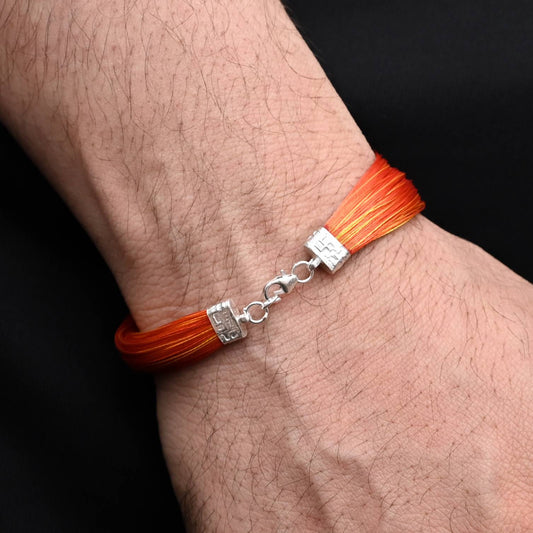 Timeless silver moli bracelet for men, showcasing a vibrant orange thread for a sophisticated look