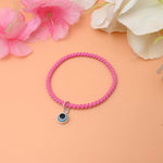 Load image into Gallery viewer, A stylish black bracelet featuring a silver evil eye charm