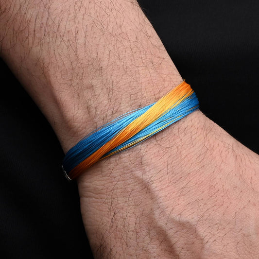 Chic silver bracelet with stylish blue and yellow design, perfect for adding a pop of color