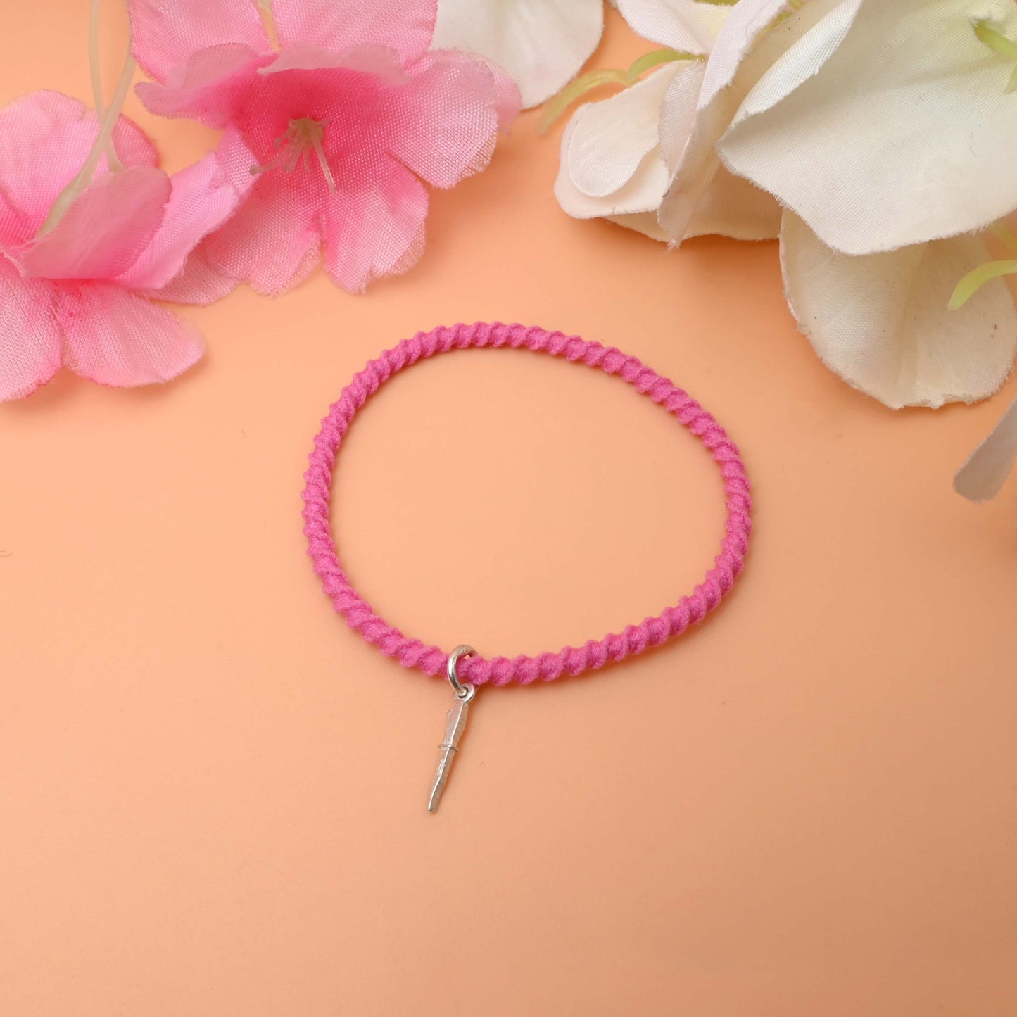 A chic black bracelet with a silver charm