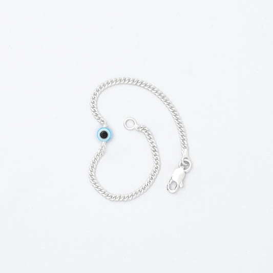 Silver bracelet with light blue evil eye charm for protection and fashion.
