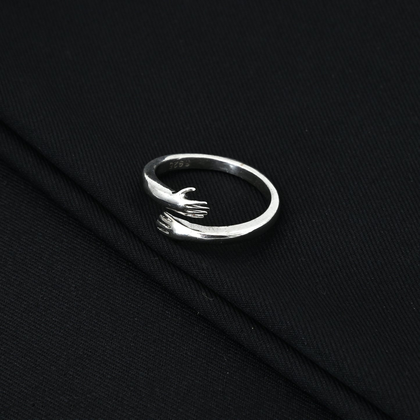 Elegant silver hug ring, ideal for special and meaningful occasions.