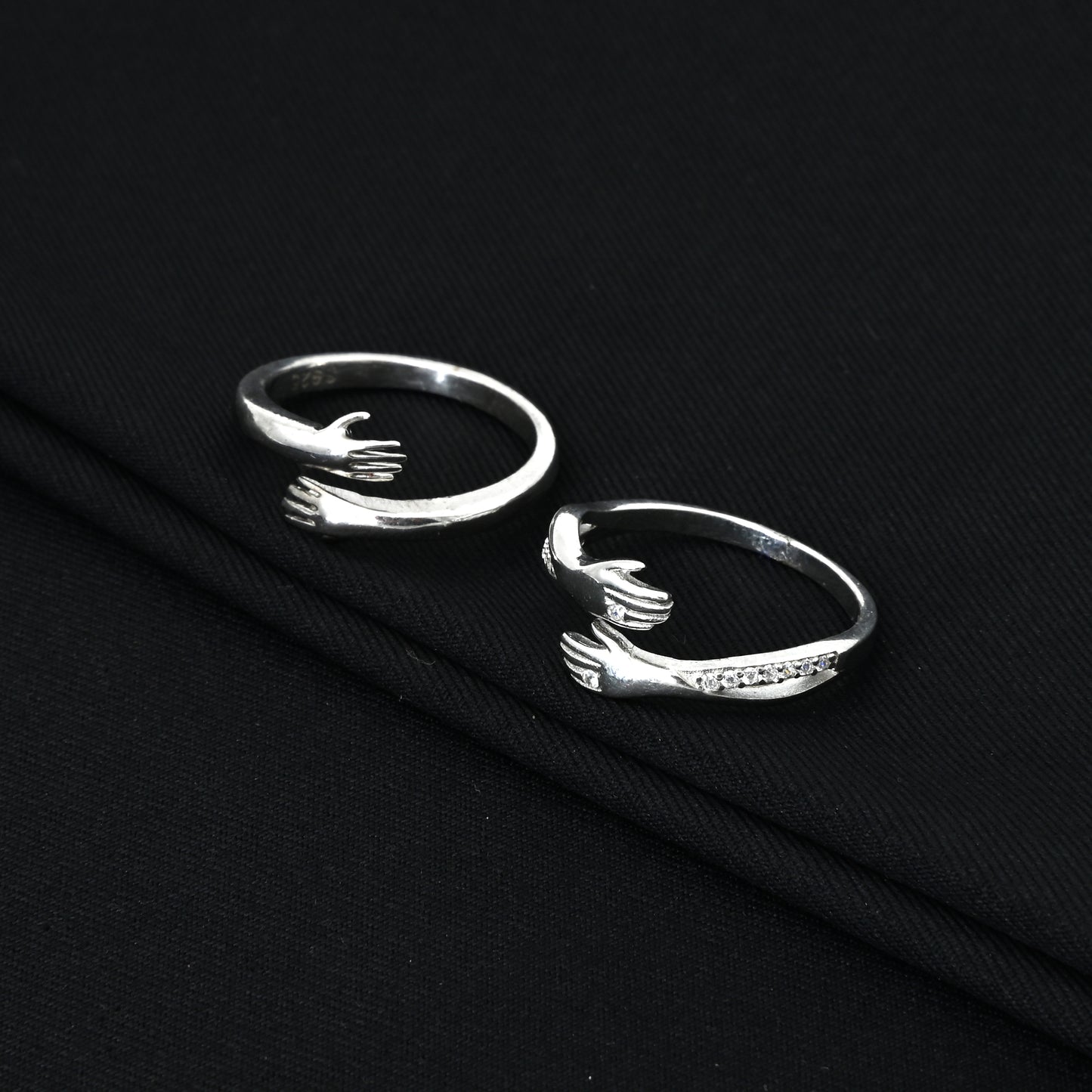 Perfect matching silver love hug rings for couples, him and her.