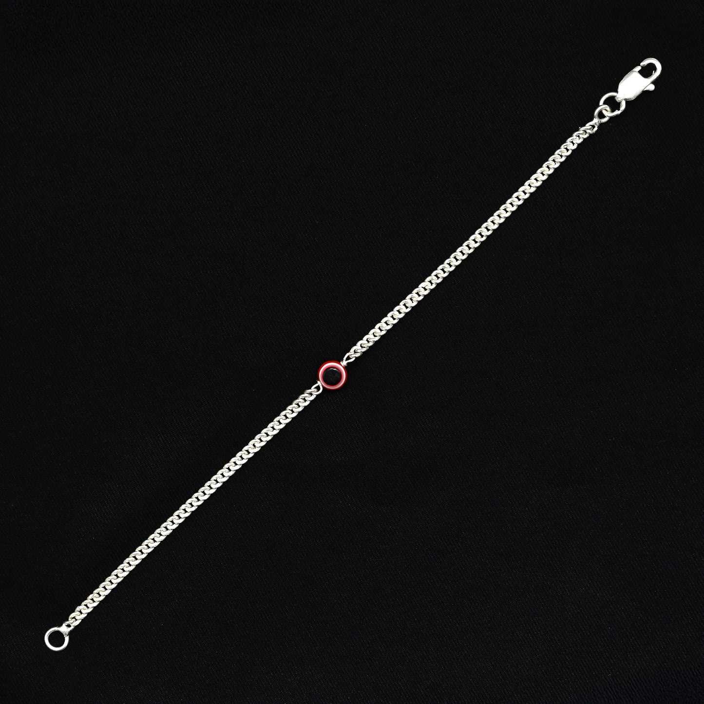 Trendy silver evil eye bracelet with a subtle pink tint for fashionable protection.