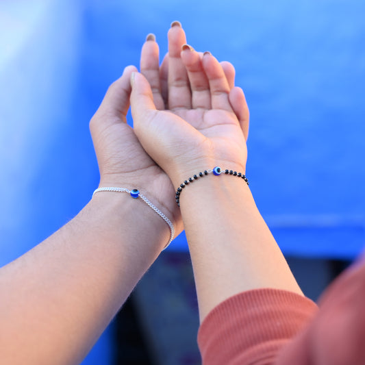 Stylish silver evil eye bracelet set for couples, offering protection.