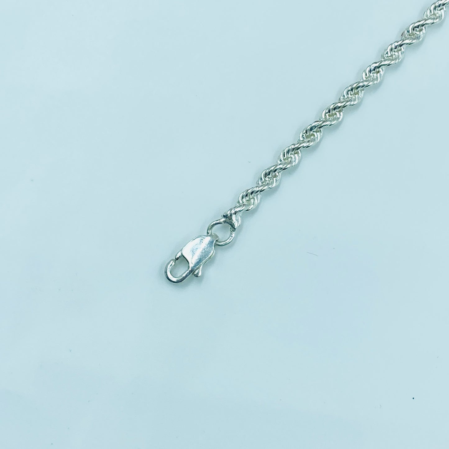 Protective silver evil eye bracelet for spiritual energy cleansing.