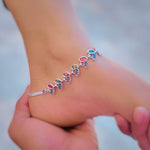 Load image into Gallery viewer, Elegant silver anklet with colorful stones and leaf accents.