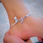 Load image into Gallery viewer, Silver anklet adorned with vibrant stones and delicate leaf designs.