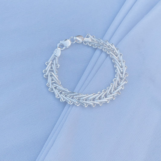 Trendy silver bracelet with a bold, unique link design for boys.