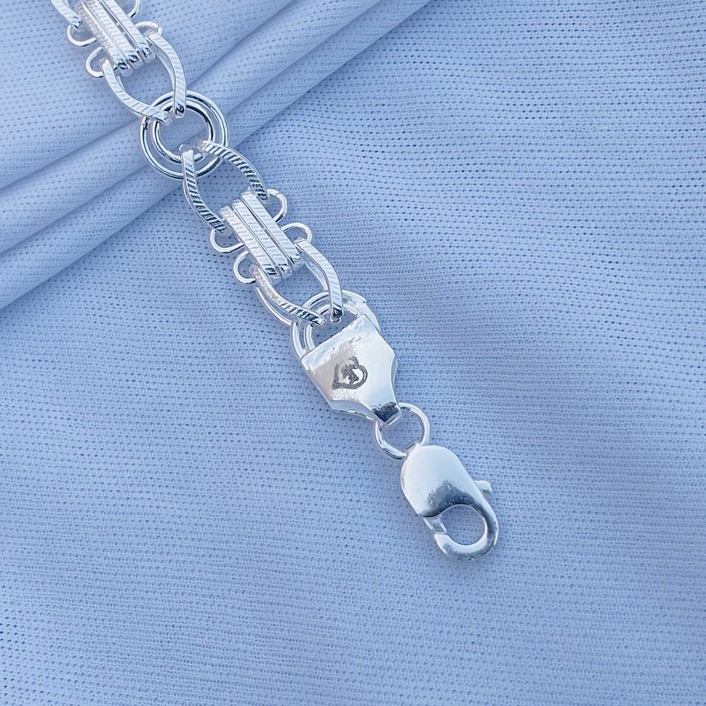 Unique link silver bracelet for boys, designed for a bold look.