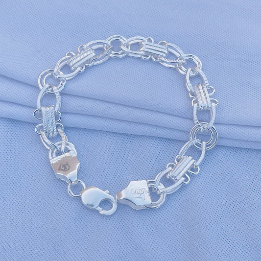 Exclusive design silver bracelet for boys, featuring unique link pattern.
