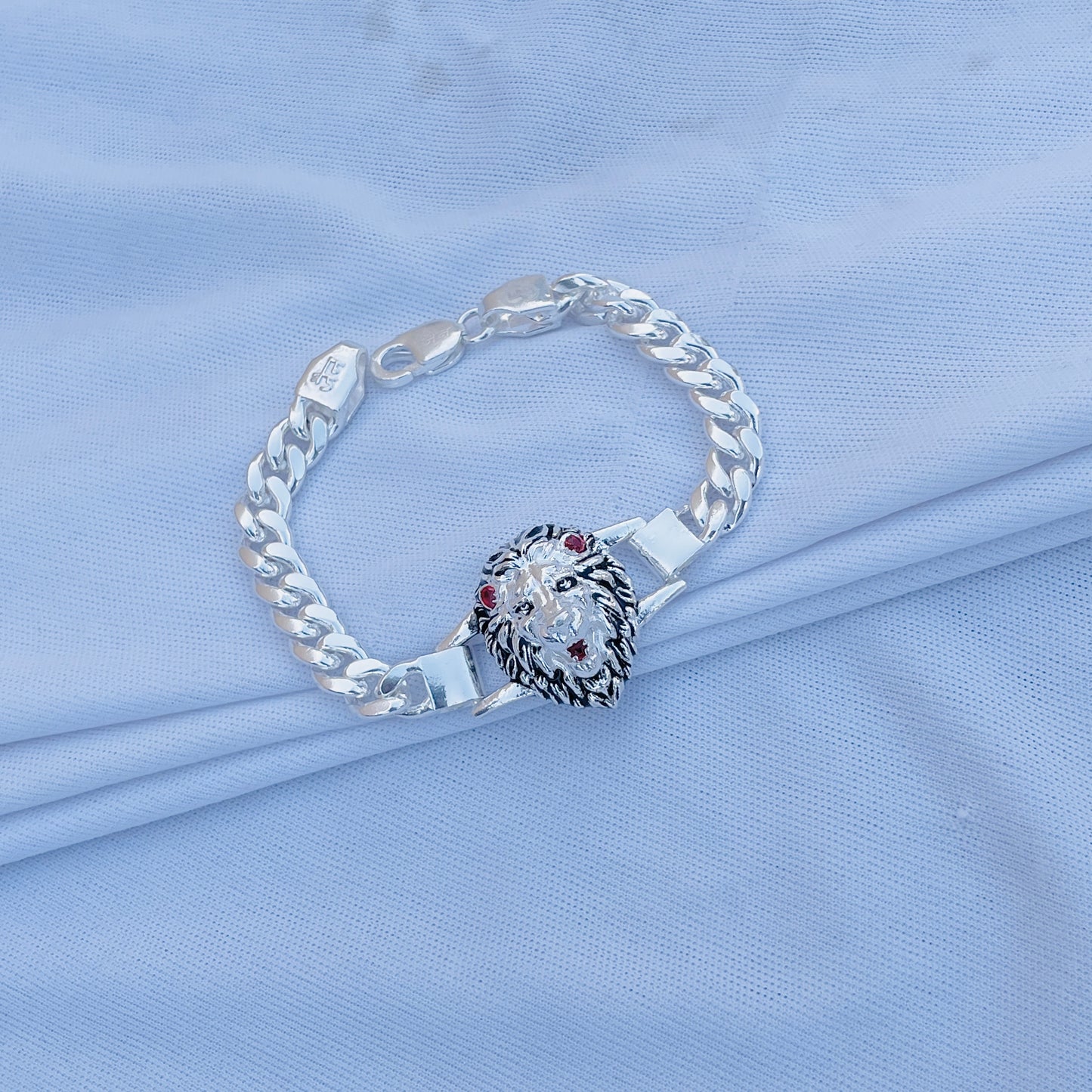 Silver bracelet with lion pendant for boys, offering a strong, fashionable look.