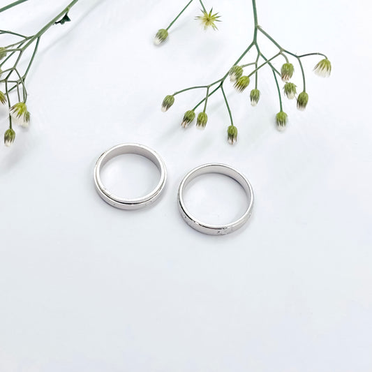Sleek Silver Couple Rings with a Beautiful and Simple Center Design.