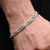 Boys' bracelet with a sterling silver band showcasing a round connecting pattern.