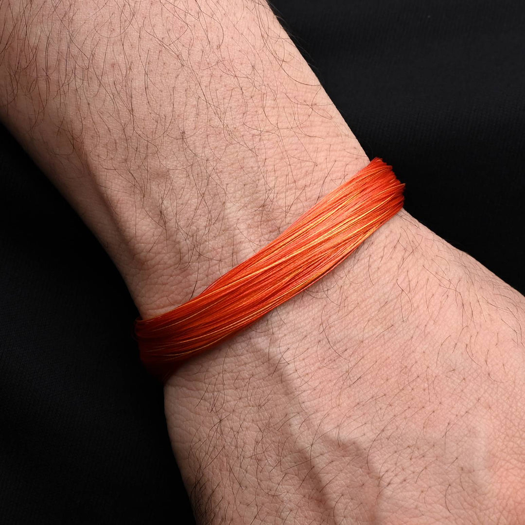 Chic silver bracelet with a classic orange moli design, perfect for a stylish, masculine touch