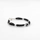 Sterling silver bracelet with black evil eye charm and black beads for girls.