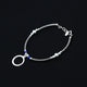 Stylish silver bracelet with a combination of beads and a ring detail.