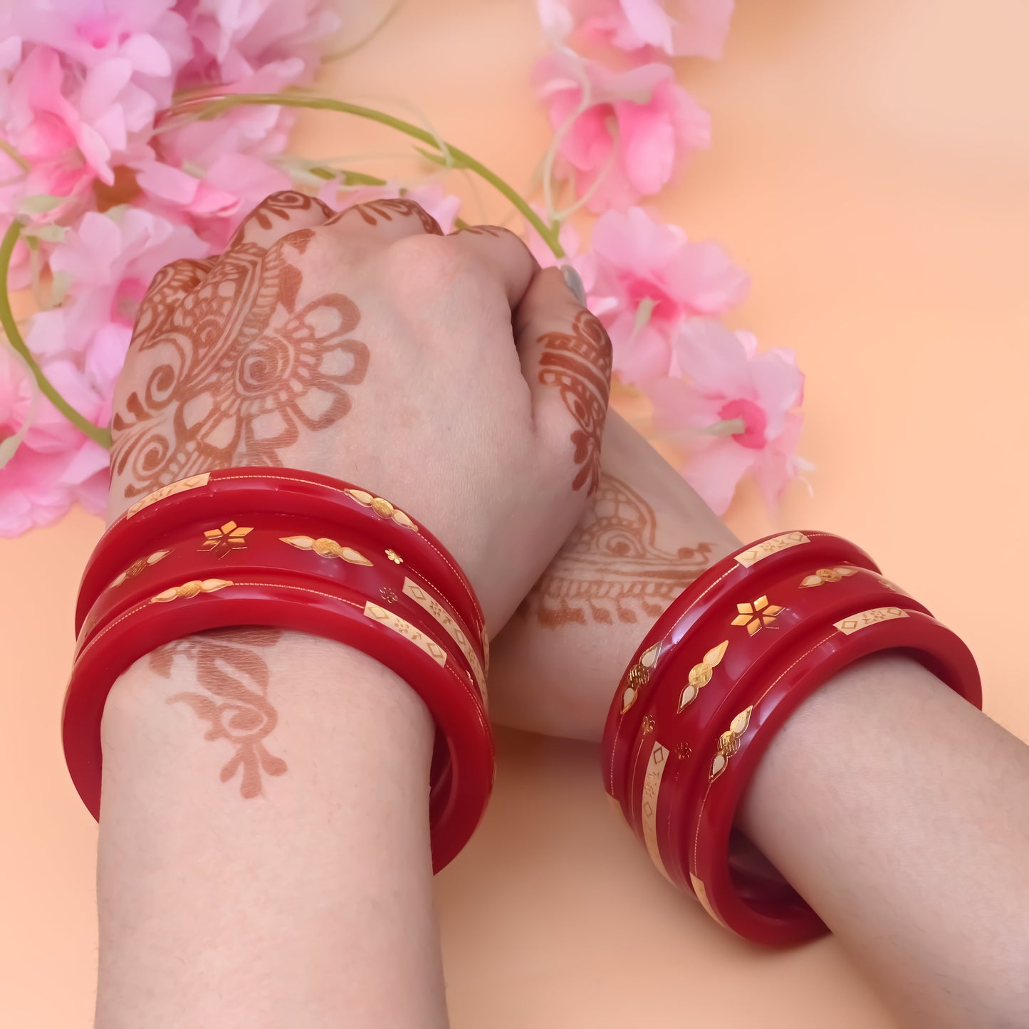 Red Gold Bangle Set Featuring Swastika Design – Stylish & Cultural.