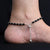 Stylish anklet with sterling silver, black beads, and ghungroo for girls.