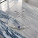 Stylish women's bracelet in sterling silver, adorned with a blue evil eye charm.