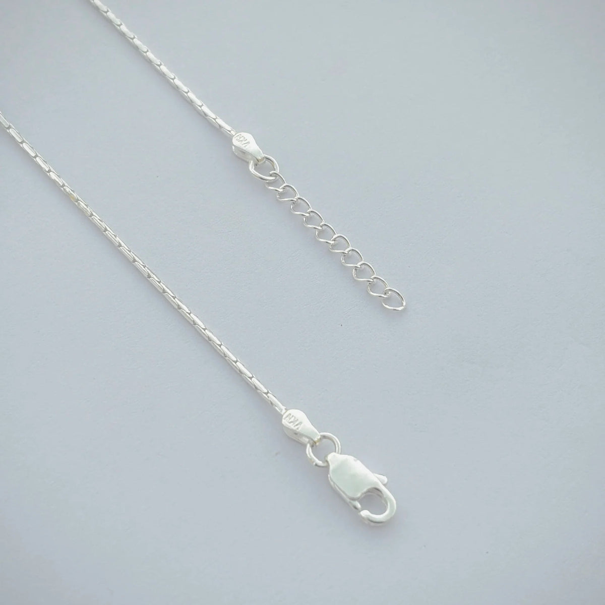 Silver anklet with ocean blue moti and delicate beads