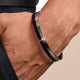 Elegant black and silver men's kada with contemporary design.