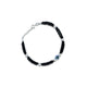 Sterling silver bracelet with evil eye charm and black beads.