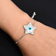 Silver bracelet featuring a shiny star charm with an evil eye design for girls.