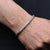 Boys' bracelet featuring a sleek silver chain design.