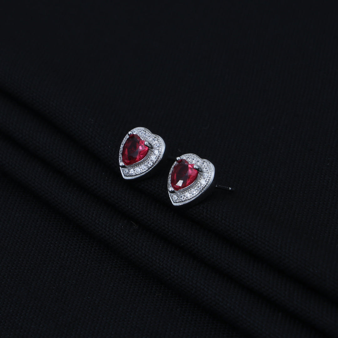 Stylish heart-shaped silver earrings adorned with pink and white stones
