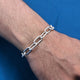 Men's bracelet featuring a sleek chain link pattern in sterling silver.