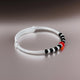 Elegant baby kada with a stylish design of black and red beads.