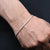 Simple sterling silver bracelet featuring a delicate thin chain.