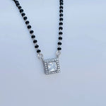 Load image into Gallery viewer, Black beaded mangalsutra featuring sparkling square pendant.
