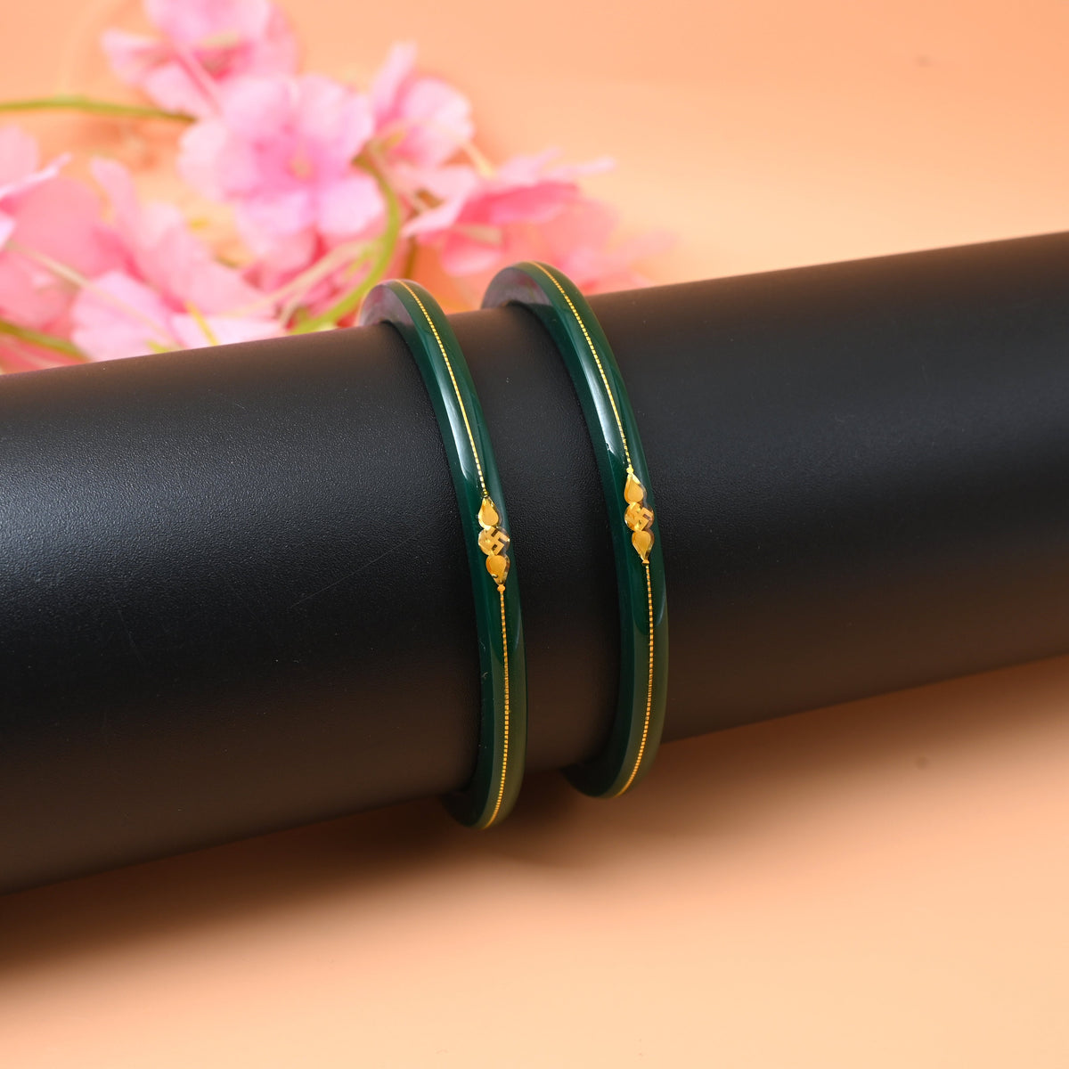 Gold small swastika design dark green bangle