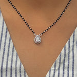 Load image into Gallery viewer, Elegant black bead mangalsutra with teardrop gemstone pendant.

