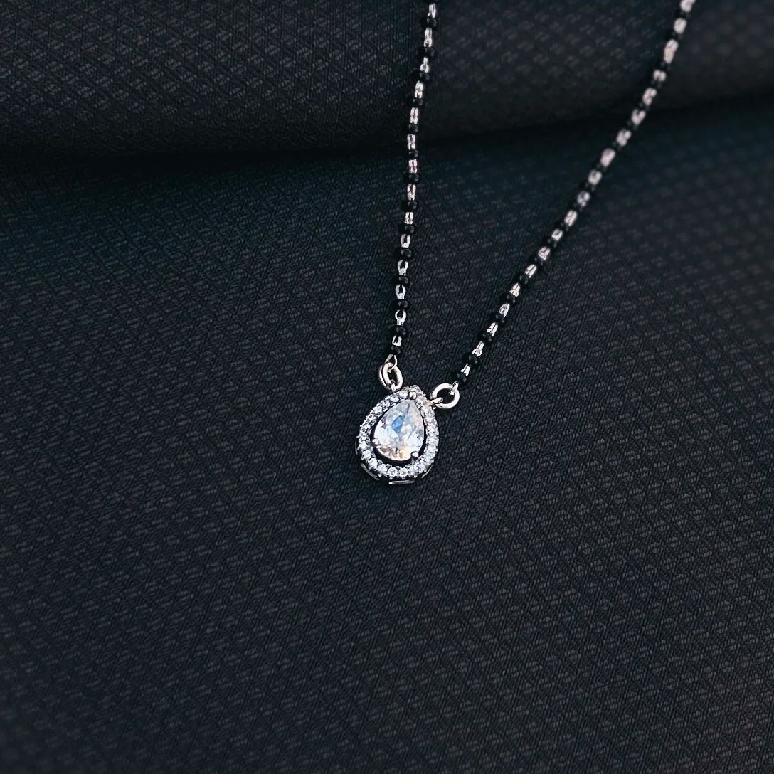 Black bead mangalsutra featuring teardrop gemstone pendant