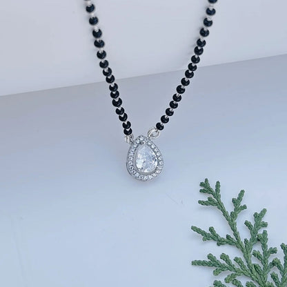 Stylish mangalsutra with black beads and teardrop pendant.