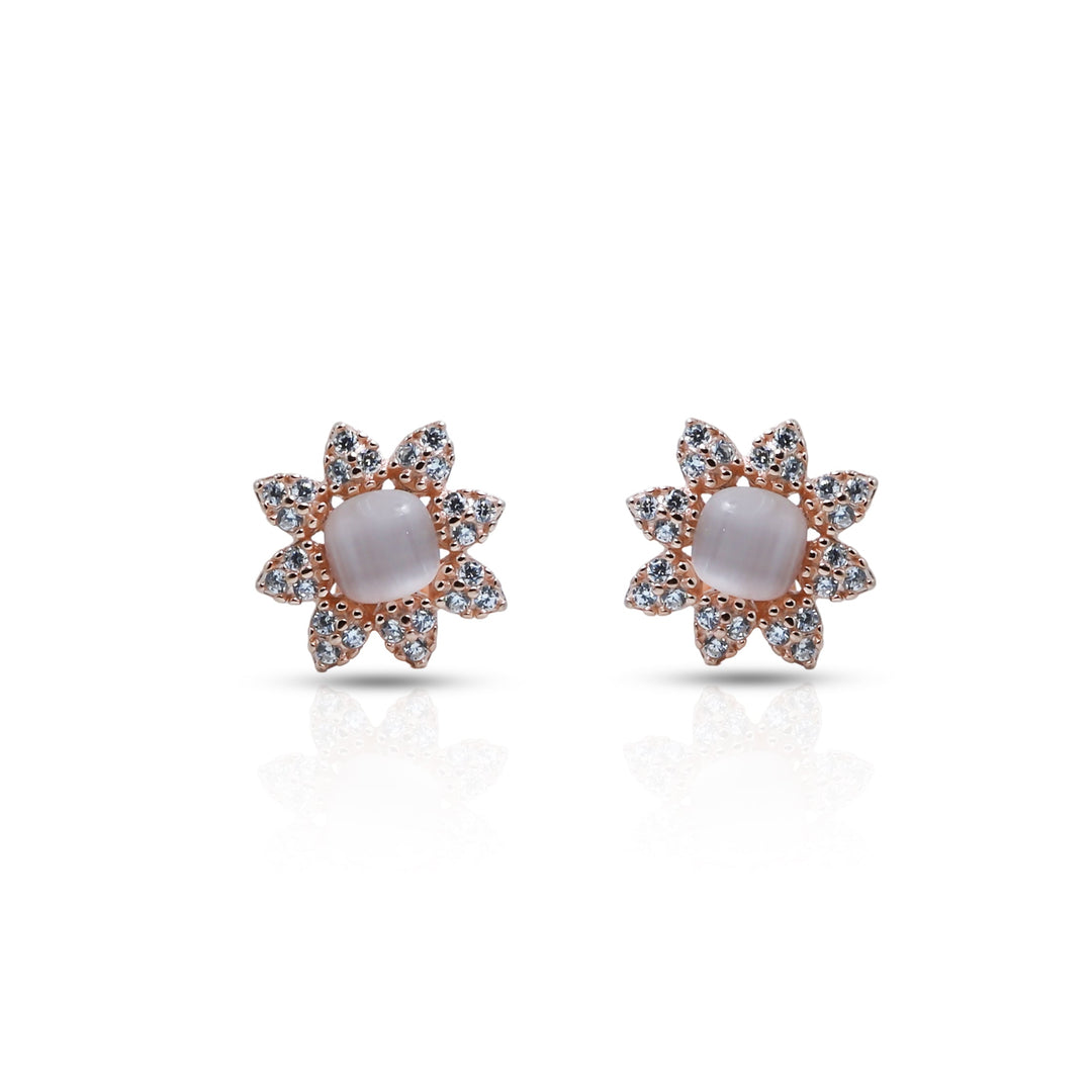 Silver stud earrings with a floral design and a pearl center