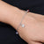 Elegant silver bracelet featuring butterfly and flower motifs for girls.