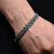 Stylish silver bracelet featuring a black chain pattern, designed for boys.