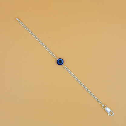 Stylish silver chain bracelet adorned with a detailed evil eye charm