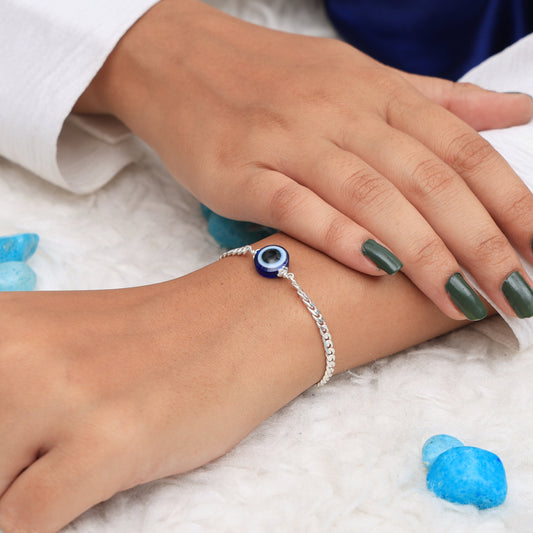 Sterling silver chain bracelet with an elegant evil eye charm